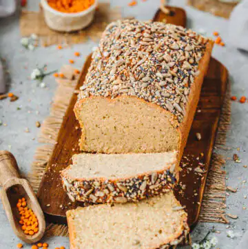 Gluten-free red lentil bread sliced ​​on a wooden board